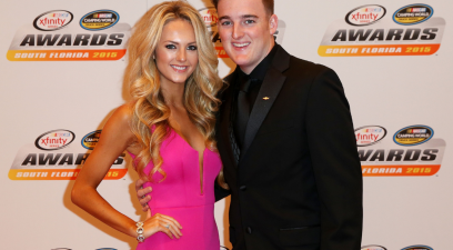 Ty Dillon and his wife Haley Carey pose on the red carpet during the 2015 NASCAR Camping World Truck Series and XFINITY Series Banquet