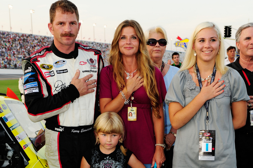 Kerry Earnhardt, driver of the #31 LibertyPort.com Chevrolet, stands with his wife Rene and their daughters Kayla and Blaise on the grid during the NASCAR Nationwide Series Subway Jalapeno 250 at Daytona International Speedway on July 3, 2009 in Daytona Beach, Florida