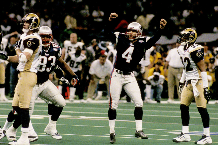New England Patriots kicker Adam Vinatieri (4) celebrates his 48-yard game-winning kick during Super Bowl XXXVI, a 20-17 victory over the St. Louis Rams