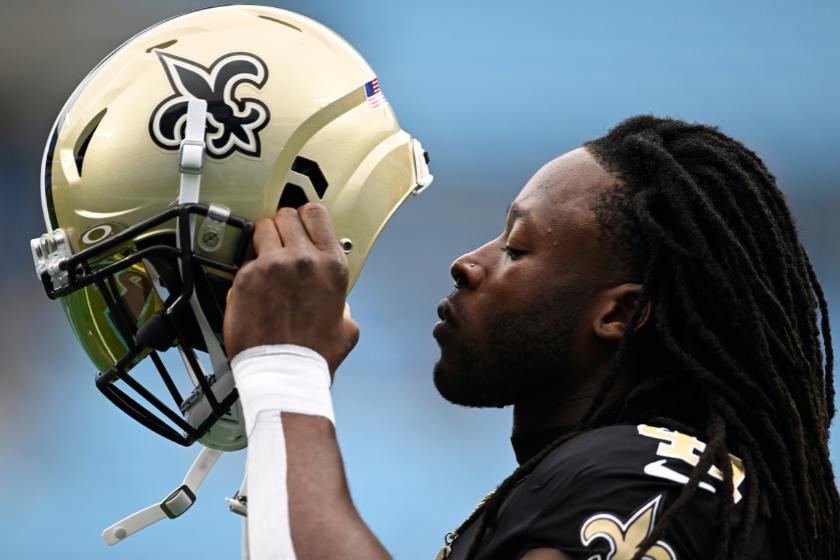 Alvin Kamara #41 of the New Orleans Saints puts on his helmet for warm ups before their game against the Carolina Panthers at Bank of America Stadium