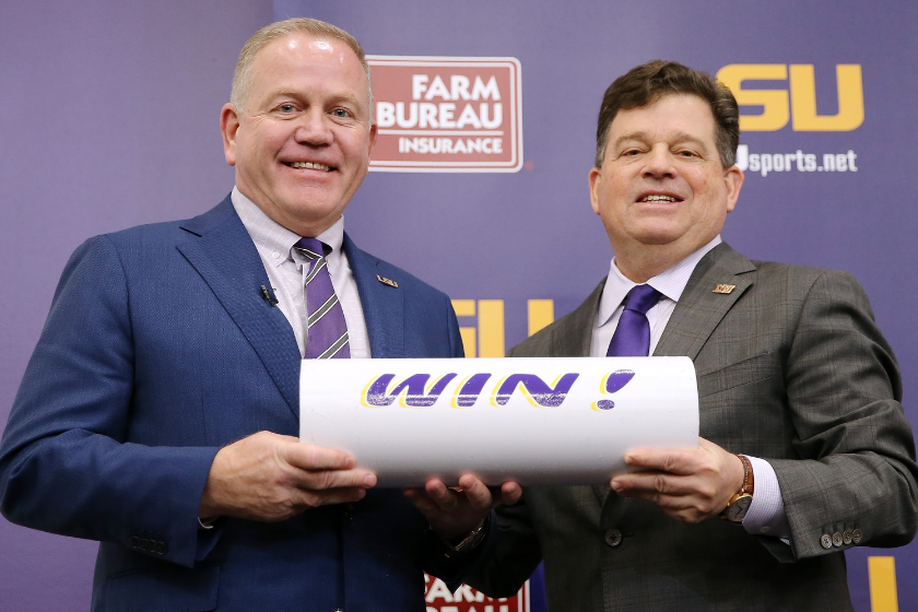 Brian Kelly (L) is introduced as the head football coach of the LSU Tigers