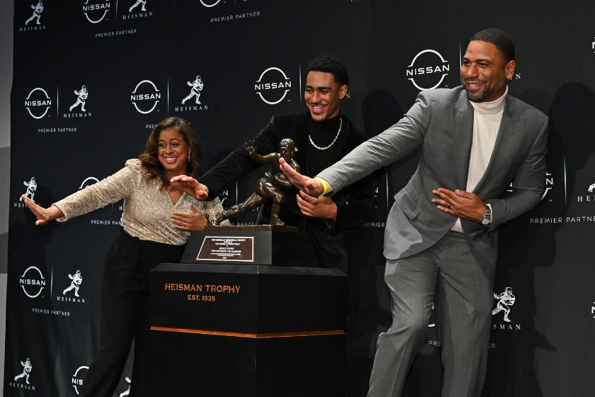 The 2021 Heisman Trophy Winner quarterback Bryce Young from Alabama and parents Julie Young and Craig Young pose at the 2021 Heisman Trophy Winners press conference