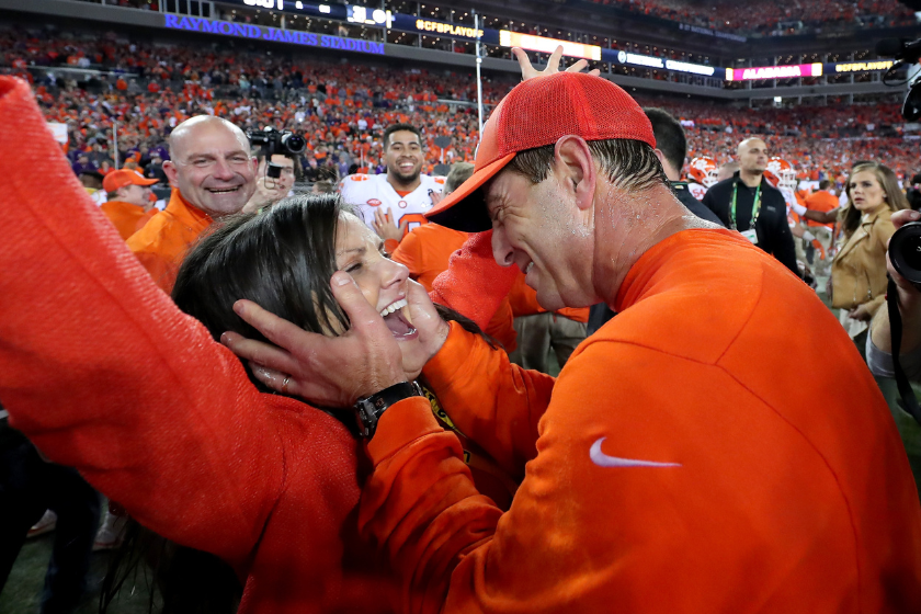 nal Championship TAMPA, FL - JANUARY 09: Head coach Dabo Swinney of the Clemson Tigers celebrates with his wife, Kathleen Swinney, after defeating the Alabama Crimson Tide 35-31 to win the 2017 College Football Playoff National Championship Game