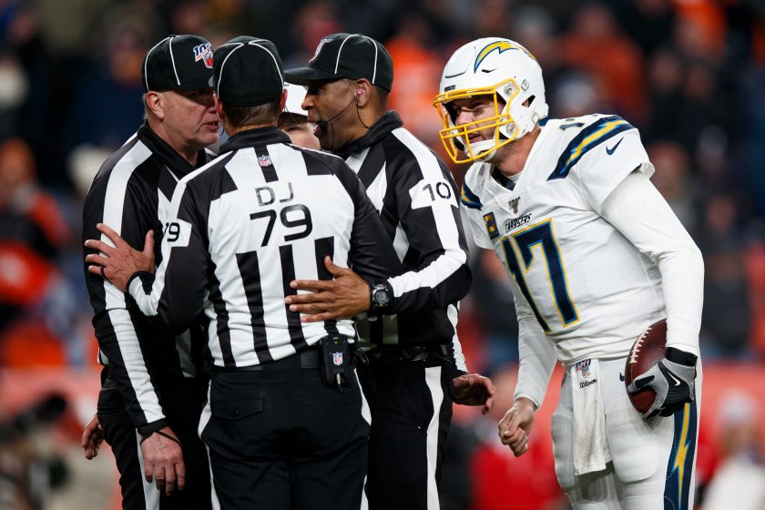 Philip Rivers talks to NFL referee during a 2019 game.