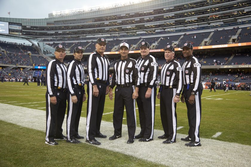 NFL Referees pose before an NFL game in 2013.