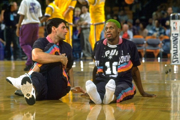 Dennis Rodman and his San Antonio Spurs teammate stretch before a game.