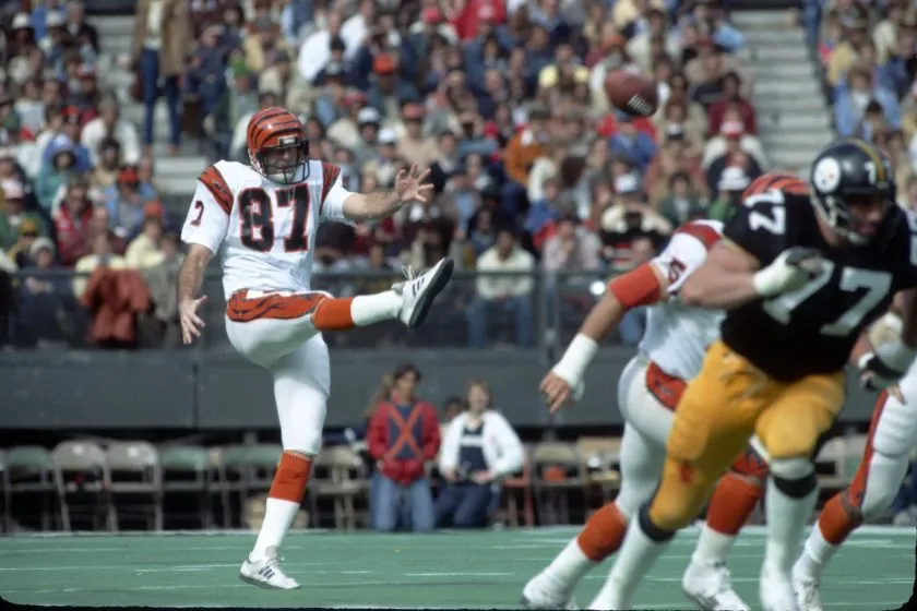 Punter Pat McInally of the Cincinnati Bengals punts against the Pittsburgh Steelers at Riverfront Stadium circa 1980.
