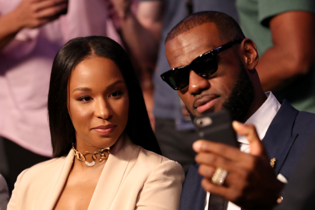 NBA player Lebron James and wife Savannah Brinson attends the super welterweight boxing match between Floyd Mayweather Jr. and Conor McGregor