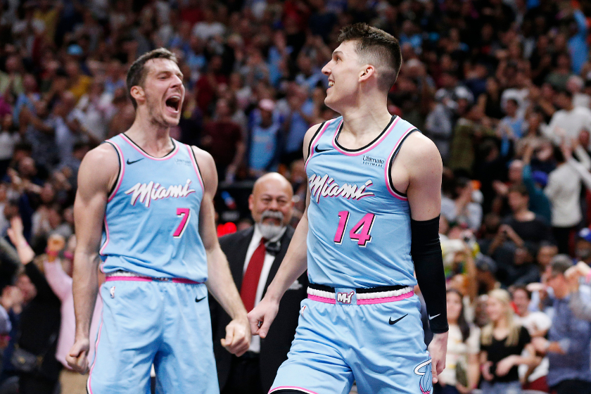 Miami Heat guards Goran Dragic and Tyler Herro celebrate after a play against the Philadelphia 76ers.