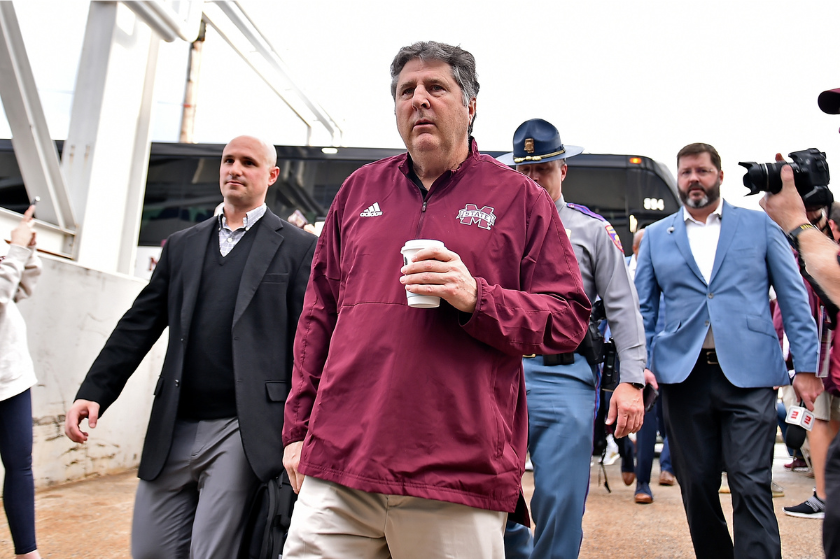 Mike Leach getting of the team bus before the AutoZone Liberty Bowl.
