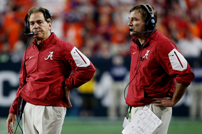  Head coach Nick Saban and then-Defensive coordinator Kirby Smart of the Alabama Crimson Tide look on from the field during the 2016 College Football Playoff National Championship Game