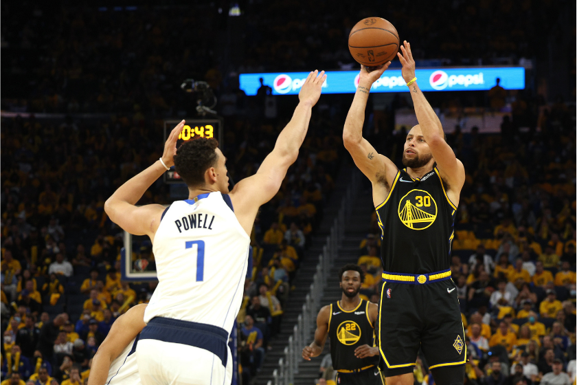 Steph Curry shoots over Dwight Powell in Game 1 of the Western Conference Finals.