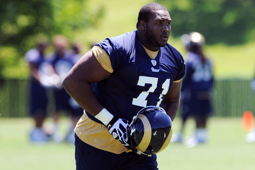 St. Louis Rams offensive lineman participates in training camp in 2013.