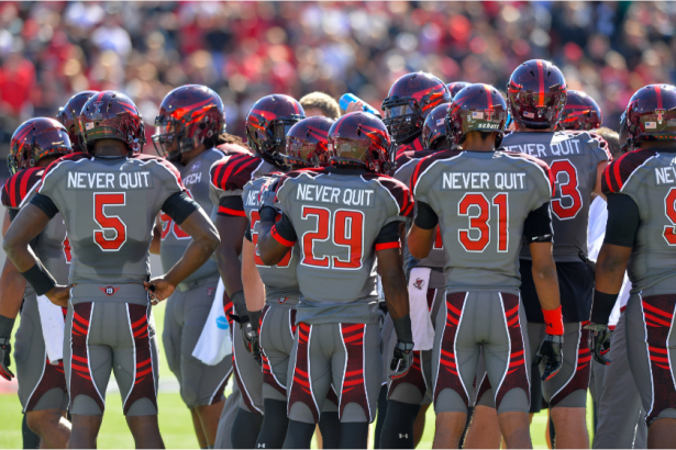 Texas tech players huddle up against Kansas State in 2013.