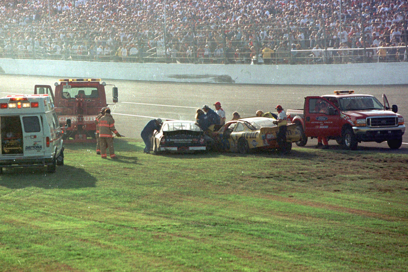 rescue workers check in on dale earnhardt's car at 2001 daytona 500