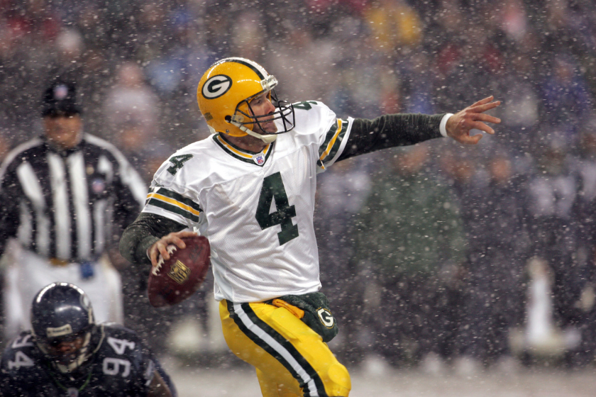 Packers quarterback Brett Favre looks to throw in a snowy game against the Seattle Seahawks.