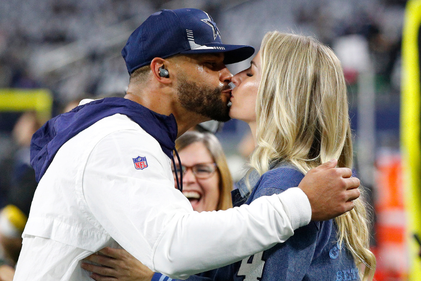 Dak Prescott #4 of the Dallas Cowboys kisses his girlfriend Natalie Buffett before the game against the Washington Football Team