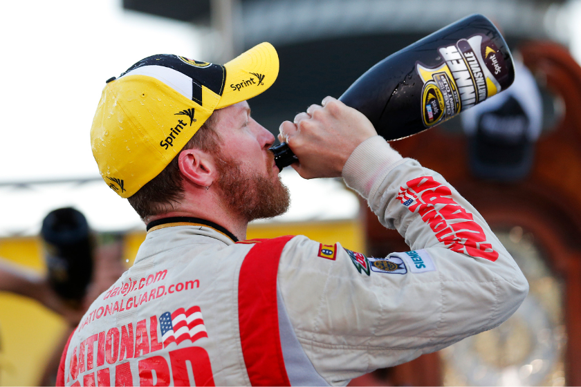 Dale Earnhardt Jr. celebrates in Victory Lane with champagne after winning during the 2014 Goody's Headache Relief Shot 500 at Martinsville Speedway