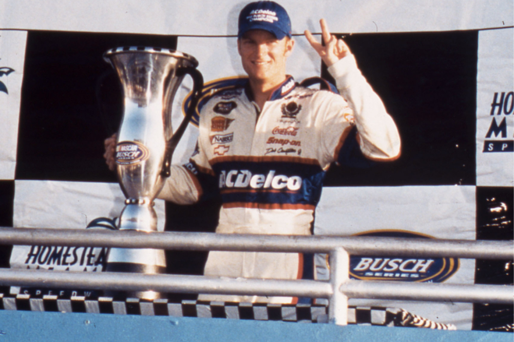 Dale Earnhardt Jr. poses with the 1999 championship trophy for the NASCAR Busch Grand National Series