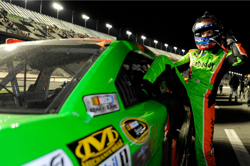 Danica Patrick climbs from her car on pit road following the 2015 Budweiser Duel 2 at Daytona International Speedway