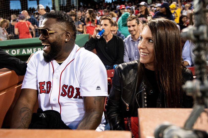 Former designated hitter David Ortiz #34 of the Boston Red Sox reacts with his wife Tiffany Ortiz after throwing out a ceremonial first pitch