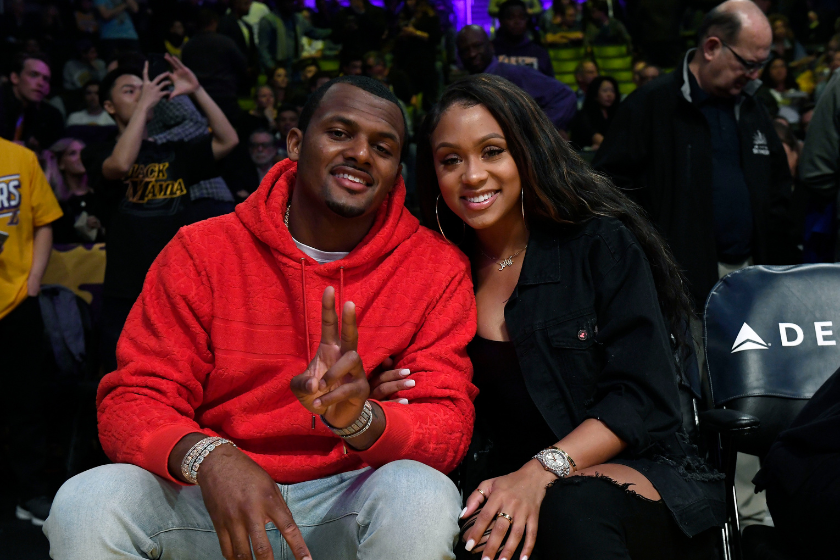 Quarterback Deshaun Watson #4 of the Cleveland Browns and Jilly Anais attend the Los Angeles Lakers and Memphis Grizzlies basketball game