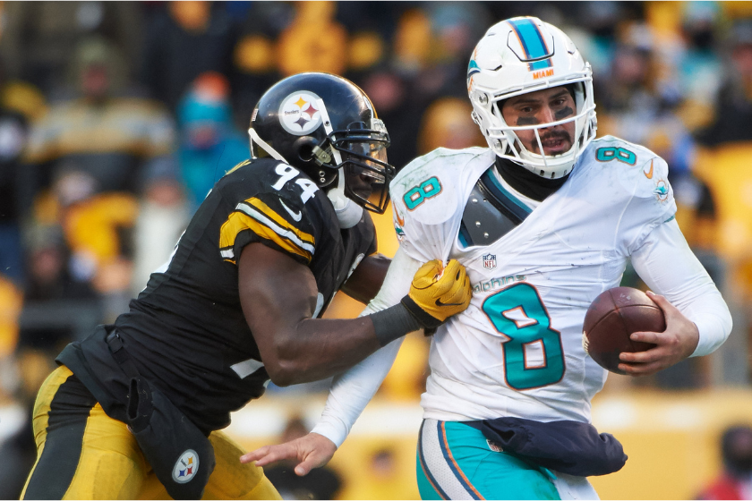 Miami Dolphins quarterback Matt Moore tries to break a tackle against the Pittsburgh Steelers in a 2017 AFC Wild Card game.