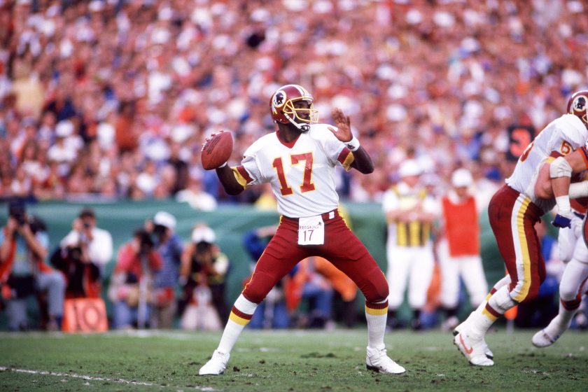 Doug Williams winds up to pass against the Denver Broncos in Super Bowl XXII.
