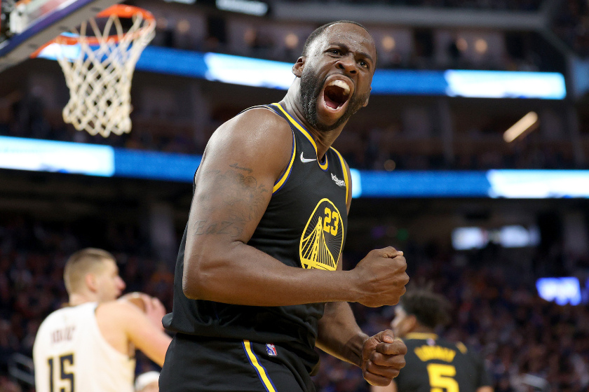 Draymond Green celebrates a big play during a Warriors game.