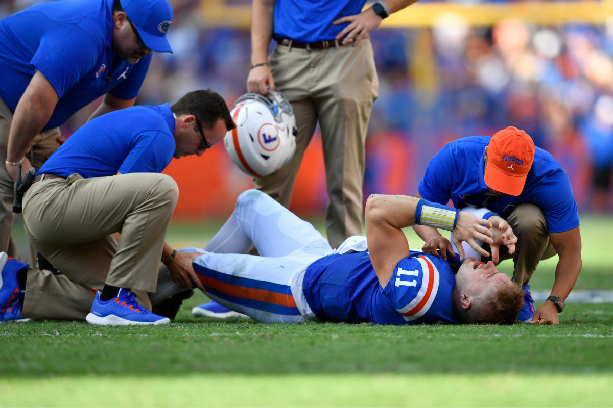 Florida trainers tend to Kyle Trask's injury during a 2019 game.