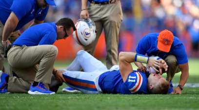 Florida trainers tend to Kyle Trask's injury during a 2019 game.