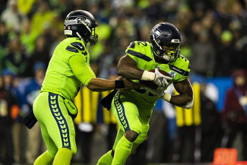 Seattle Seahawks QB Russell Wilson hands the ball off. 