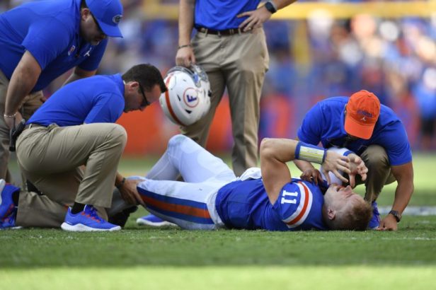 Florida trainers tend to Kyle Trask's injury during a 2019 game.