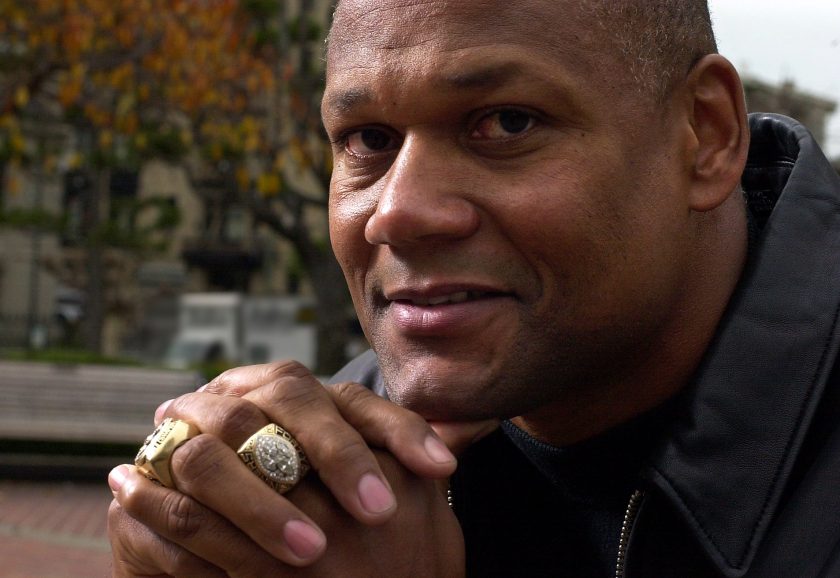 Mike Wilson shows off his Super Bowl rings in 2001.