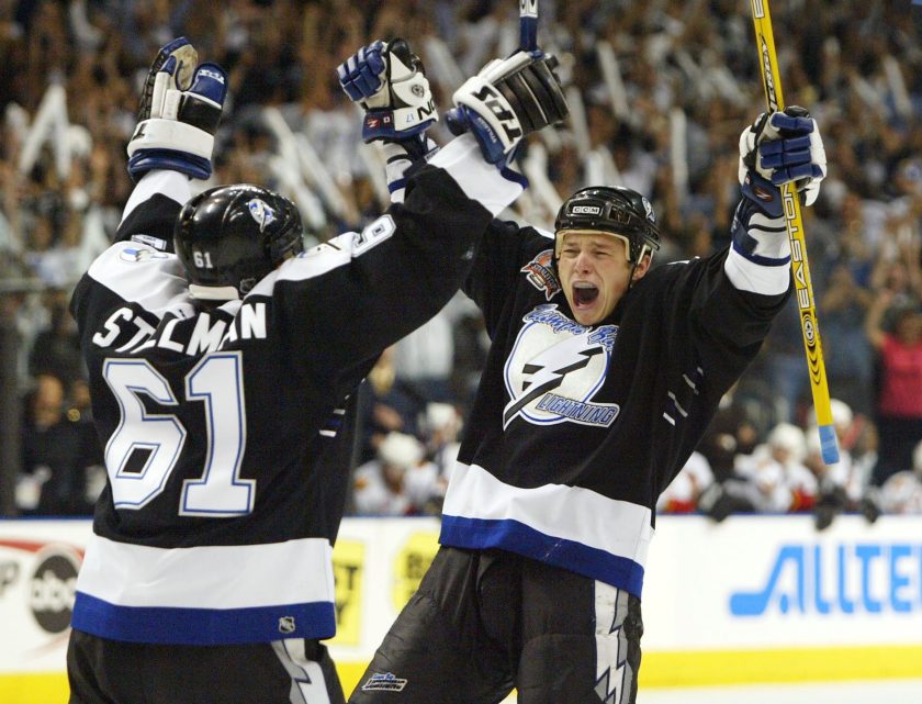 Tampa Bay Lightning players celebrate during a NHL game.