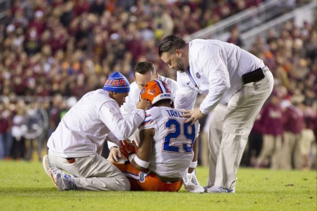 Athletic trainers tend to Florida DB Jeawon Taylor during a 2016 game.