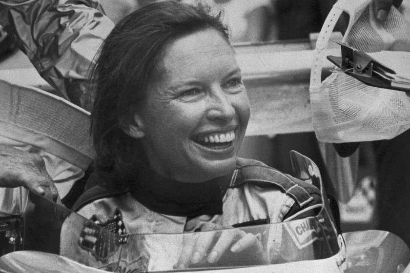 Janet Guthrie grins from the cockpit of her racer 5/22 after becoming the first woman ever to qualify for the Indianapolis 500