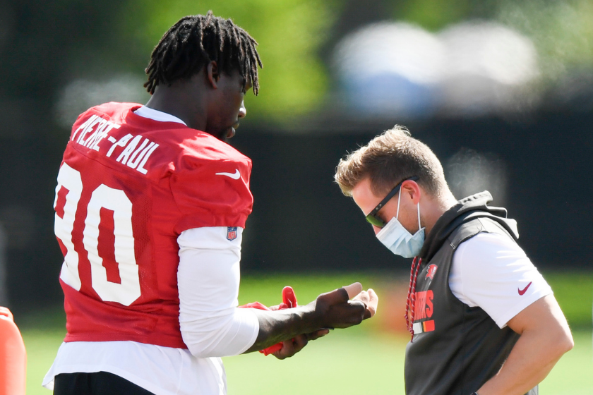 Jason Pierre-Paul tends to his hand during training camp with the Tampa Bay Bucs