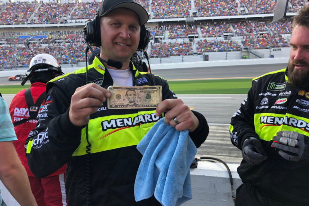 Jeremy Bullins, Ryan Blaney's crew chief, holds up five-dollar bill during 2019 daytona 500