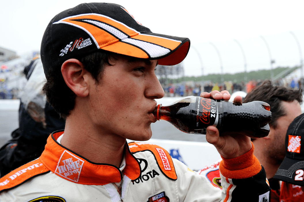Joey Logano takes a drink after winning the 2009 LENOX Industrial Tools 301 at New Hampshire Motor Speedway