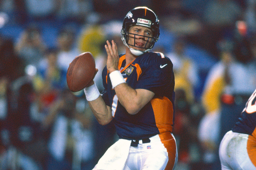 Broncos quarterback John Elway sits in the pocket against the Green Bay Packers in super Bowl XXXII.