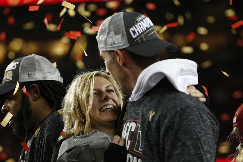 Head Coach Kyle Shanahan of the San Francisco 49ers stands with his wife Mandy during the NFC Championship trophy ceremony following game against the Green Bay Packers at Levi's Stadium 