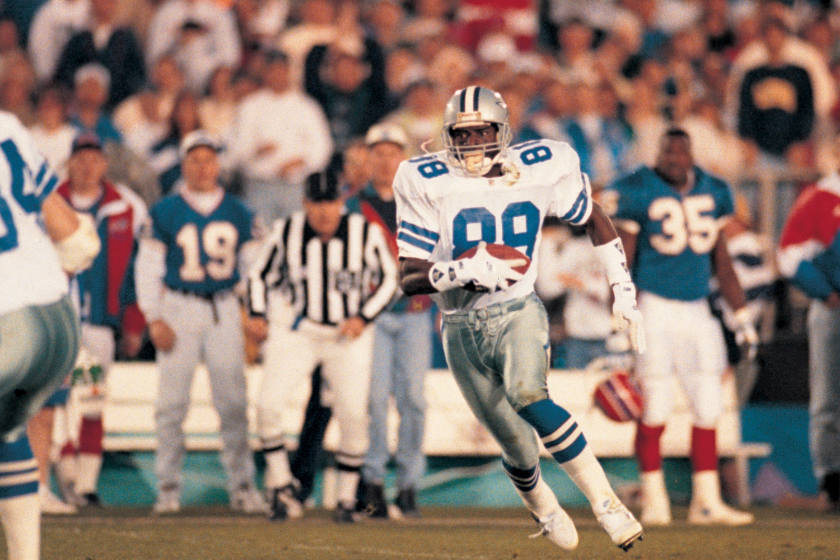 Dallas Cowboys wide receiver Michael Irvin runs against the Buffalo Bills in Super Bowl XXVII.