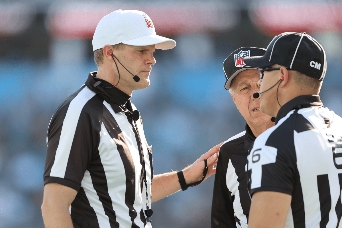 NFL referees discuss a play during a 2022 NFL game.