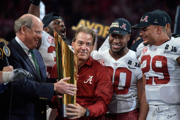 Alabama head coach Nick Saban is presented the trophy after beating Georgia in the College Football Playoff National Championship.