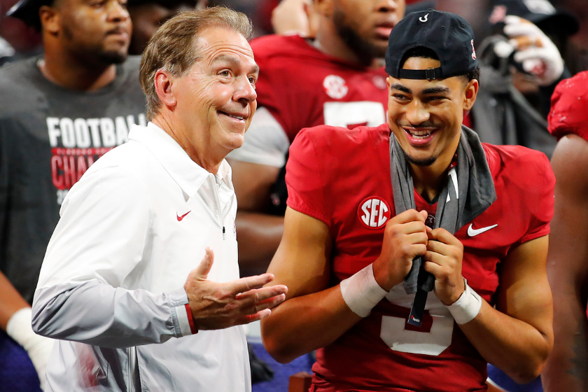 Alabama head coach Nick Saban celebrates with quarterback Bryce Young after beating Georgia in the 2021 SEC Championship Game.