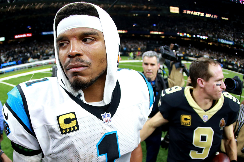 Carolina Panthers quarterback Cam Newton shakes hands with New Orleans Saints QB Drew Brees after losing in the 2018 NFL Playoffs.