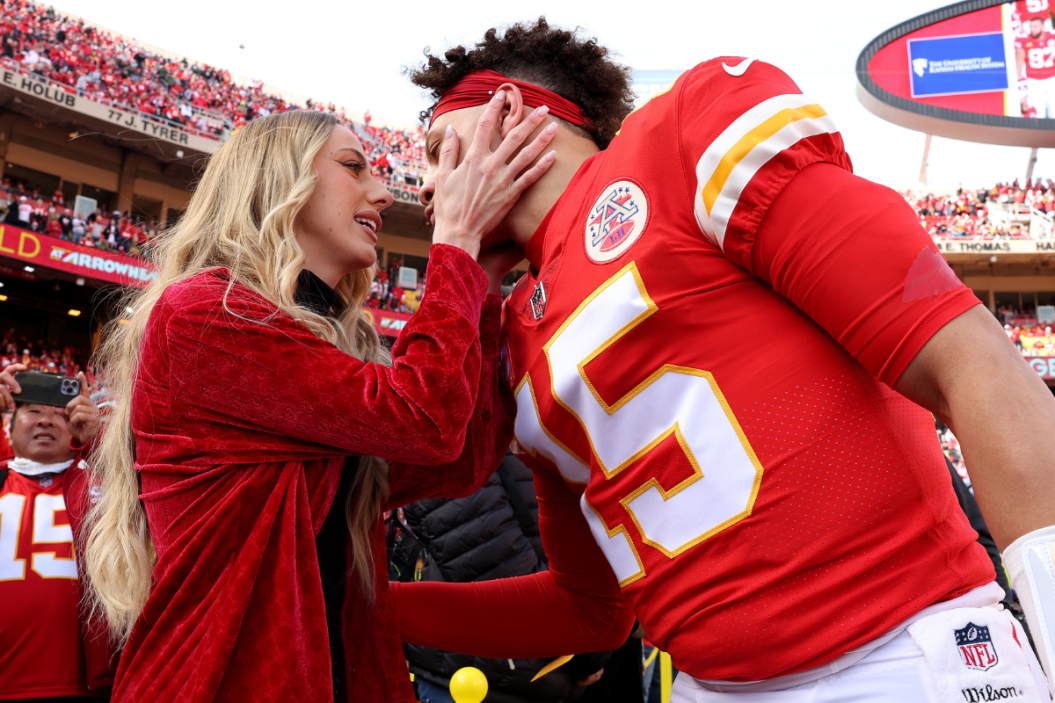 Patrick Mahomes embraces his fiance before the 2022 AFC Championship against the Cincinnati Bengals.