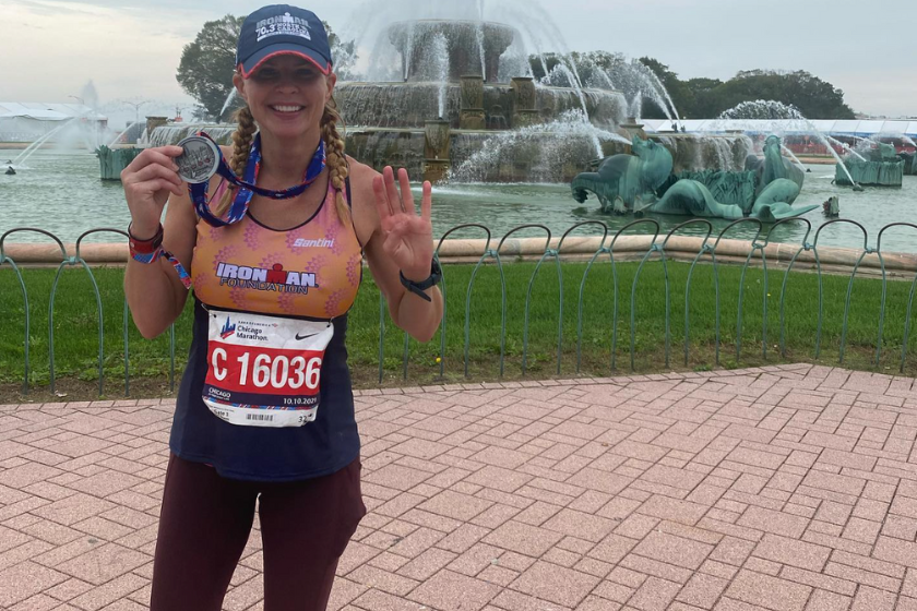shannon spake posing with medal after marathon