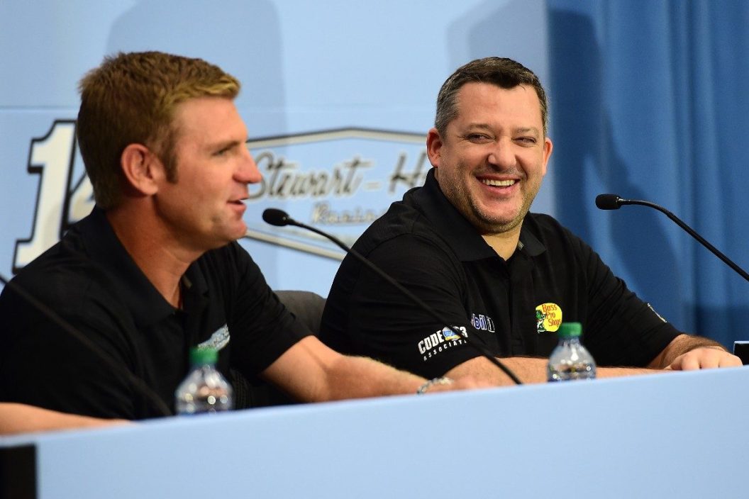 tony stewart laughing during press conference with clint bowyer